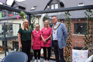 Mayor with members of the Mantles Court team